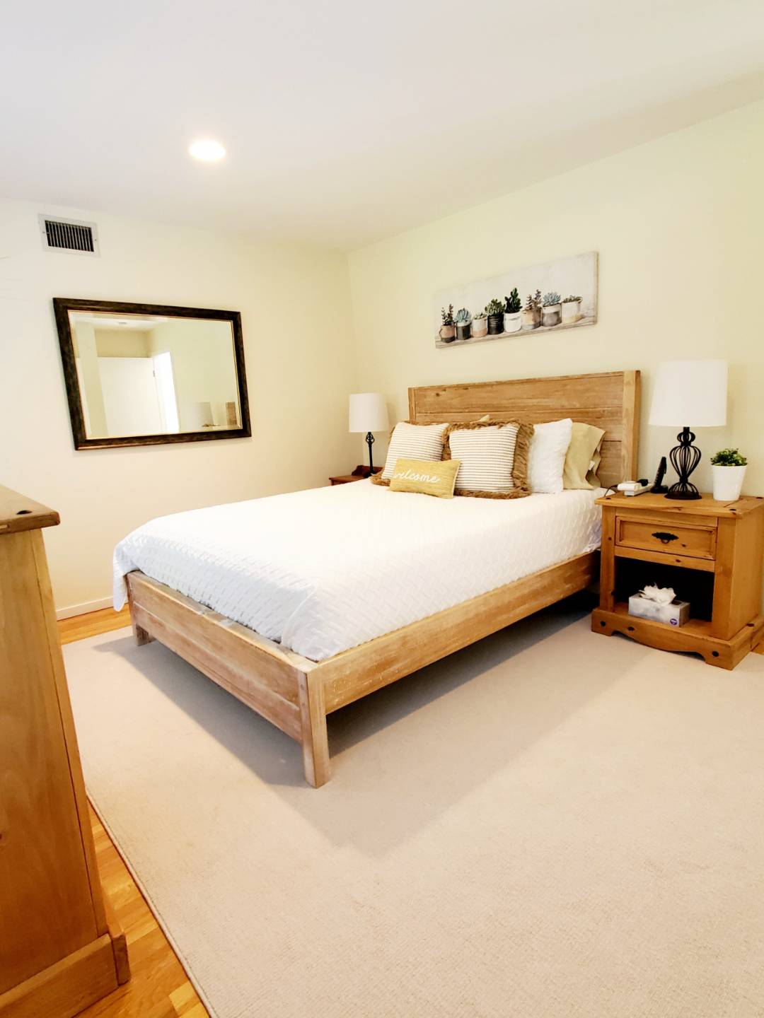 Undisclosed Address Remsenburg, NY 11960 - Photo 14 of 17 a bedroom with a bed and lamp