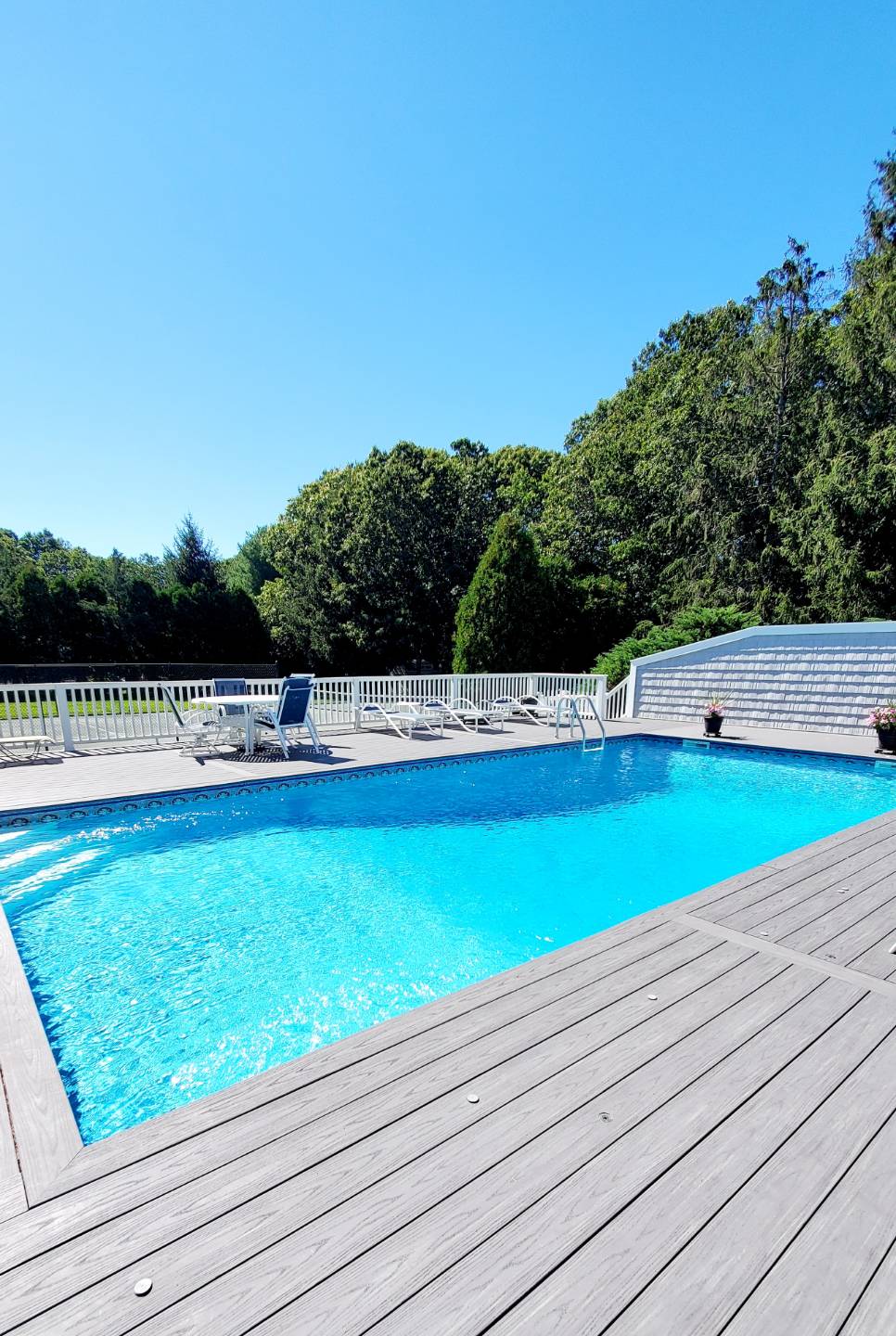 Undisclosed Address Remsenburg, NY 11960 - Photo 15 of 17 a view of a swimming pool with an outdoor space and seating area