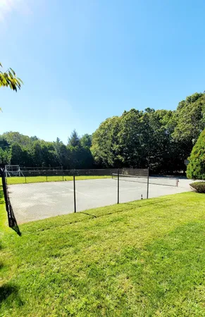 a swimming pool with wooden fence