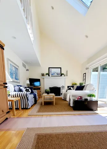 a living room with furniture or couch and a fireplace