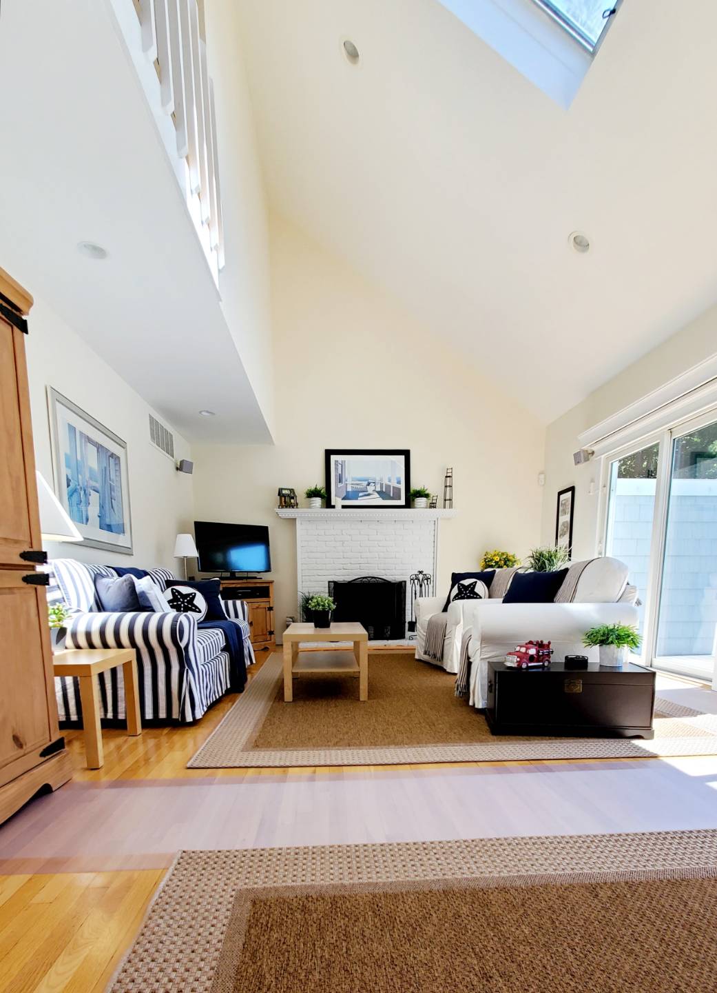 Undisclosed Address Remsenburg, NY 11960 - Photo 3 of 17 a living room with furniture or couch and a fireplace