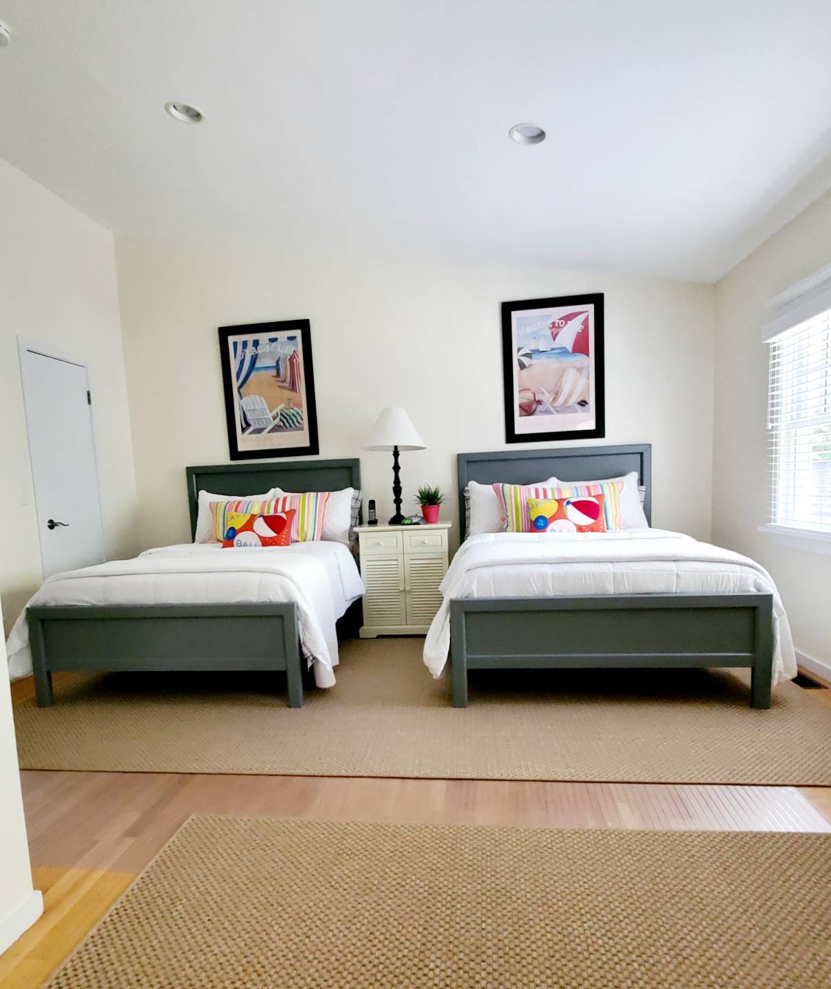 Undisclosed Address Remsenburg, NY 11960 - Photo 8 of 17 a bedroom with a bed a wall painting and a window