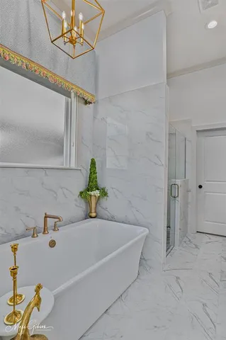 a bathroom with a tub and a shower