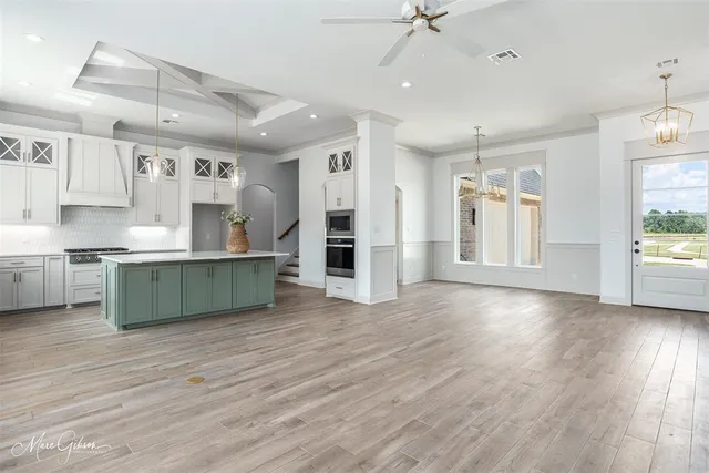 a view of kitchen with cabinets and wooden floor