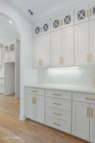 a kitchen with white cabinets