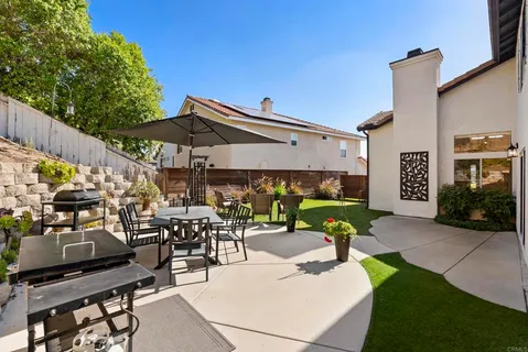 a view of outdoor dining space with a patio