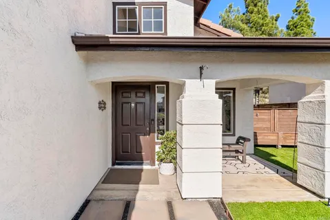 a view of hall way with furniture and fireplace