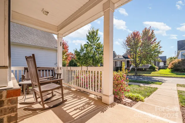 a view of a balcony with chairs