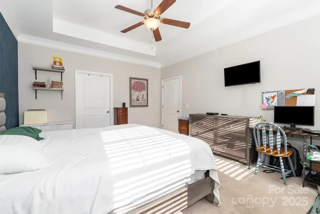 a bathroom with a double vanity sink a mirror and a bathtub