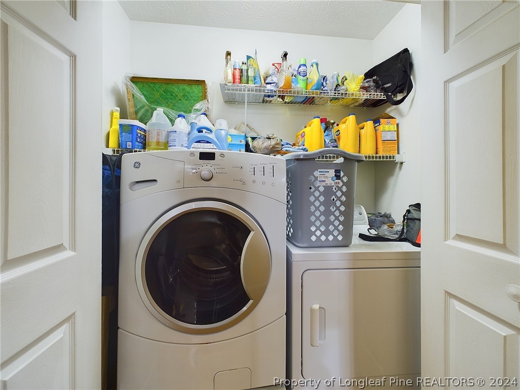 6948 Rockfish Road Raeford, NC 28376 - Photo 26 of 39 a utility room with dryer and washer