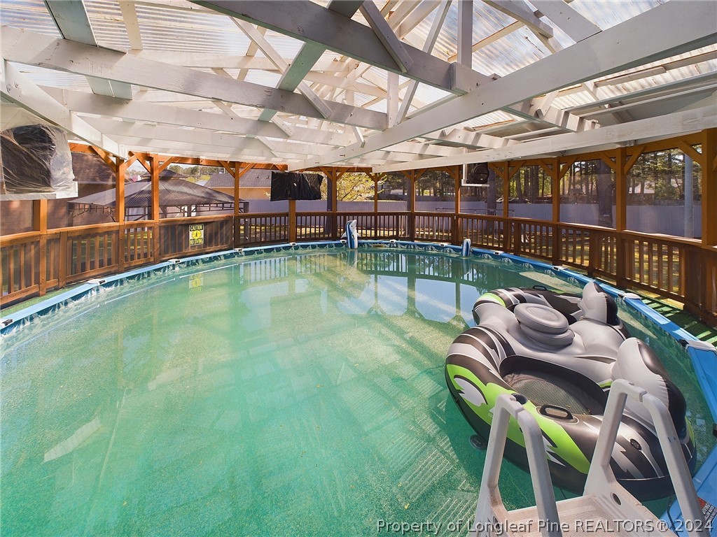 6948 Rockfish Road Raeford, NC 28376 - Photo 36 of 39 a view of a swimming pool with a patio