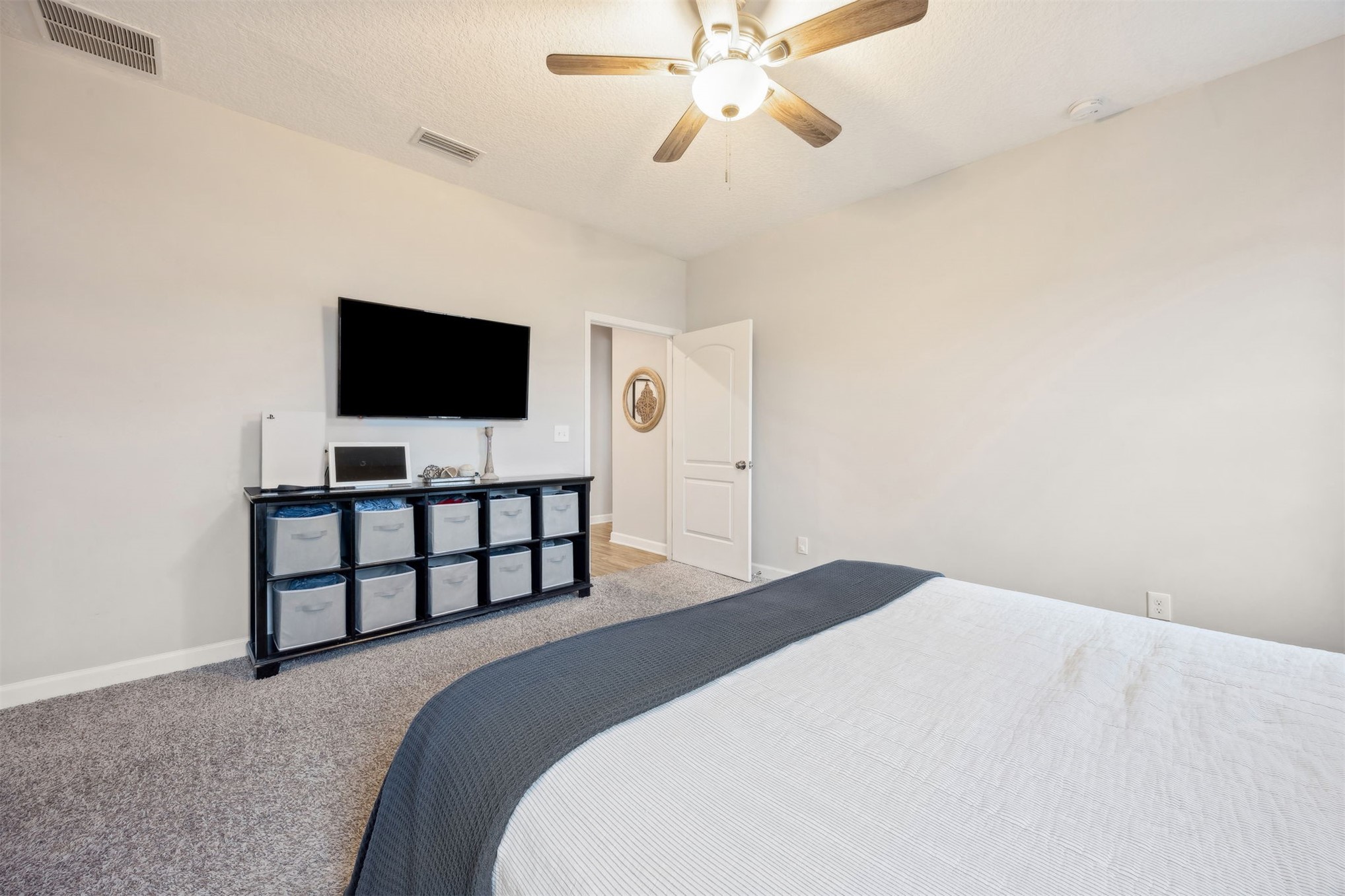 96718 Blackrock Road Yulee, FL 32097 - Photo 33 of 54 a bedroom with a bed and a flat screen tv