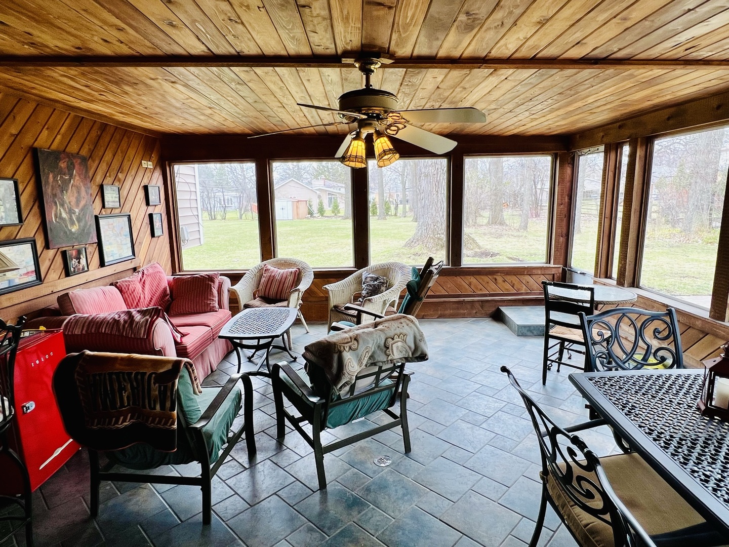 1322 Pfingsten Road Glenview, IL 60025 - Photo 22 of 28 a living room with furniture a ceiling fan and a window