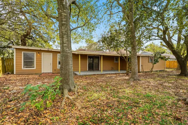 front view of a house with a trees