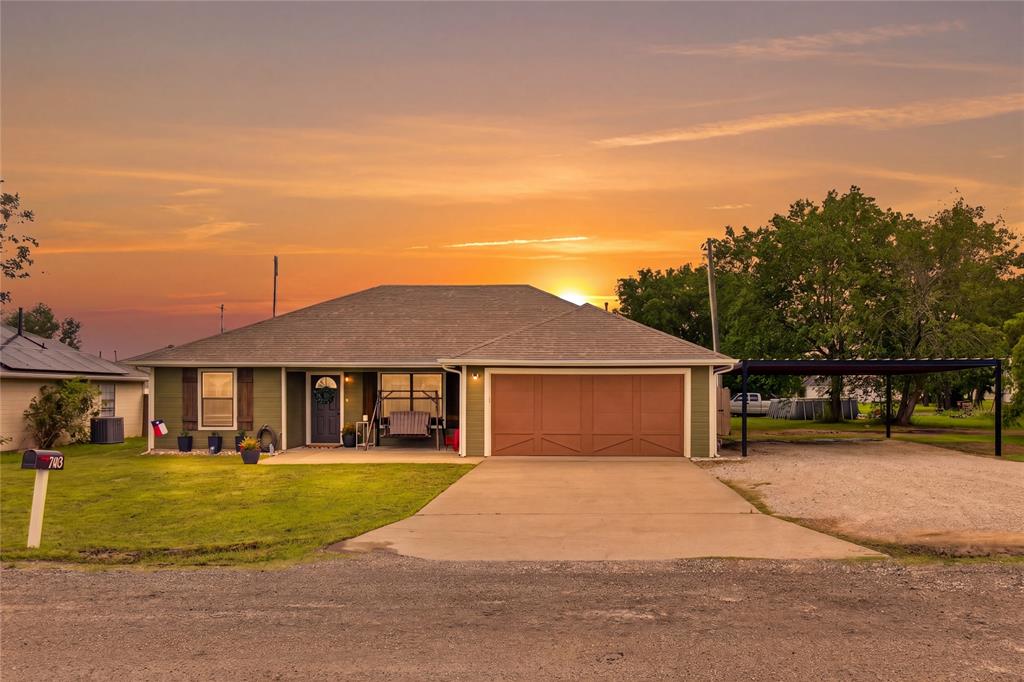 703 College Street Celeste, TX 75423 - Photo 1 of 29 a front view of a house with a yard