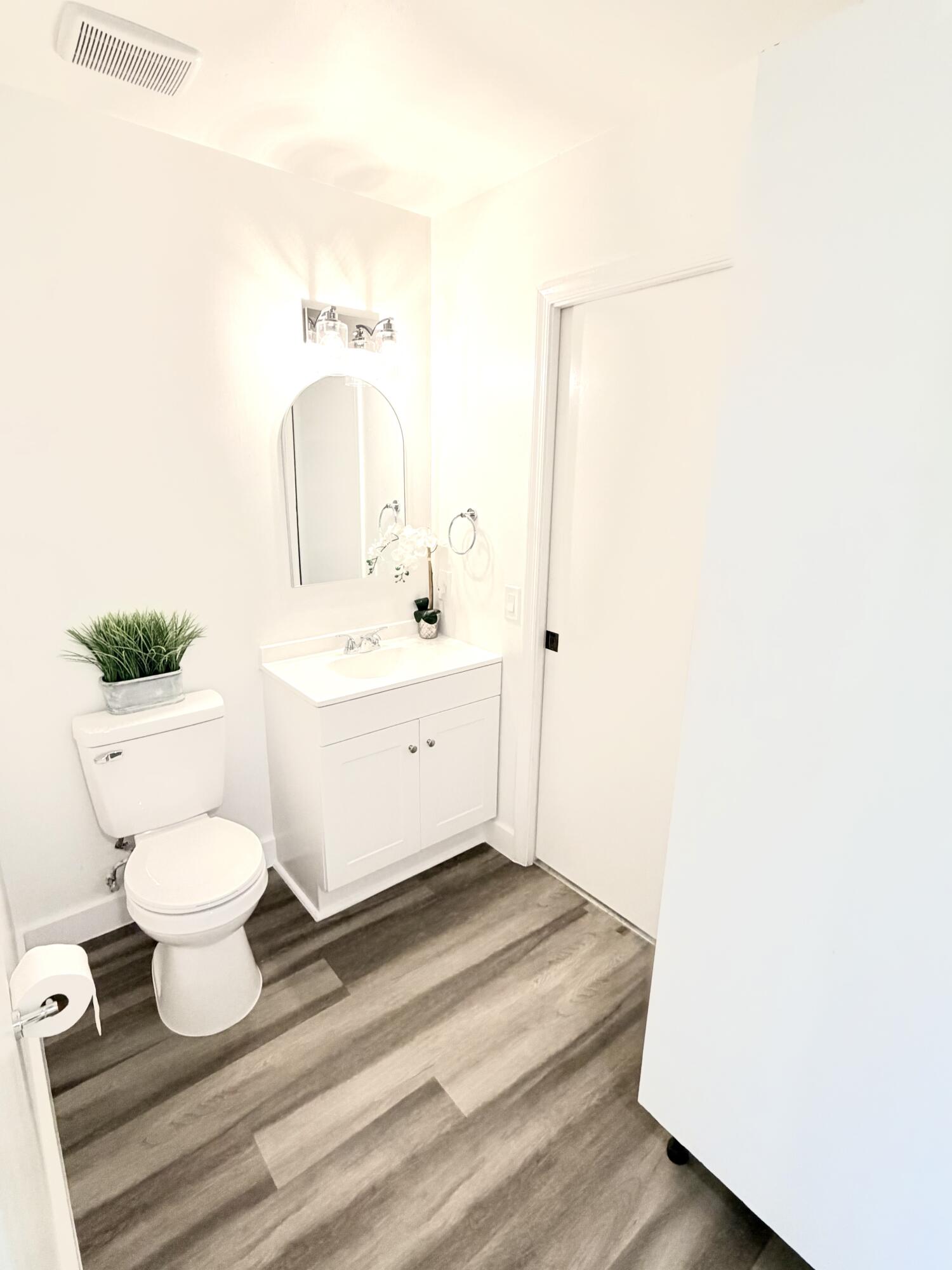 11697 Southwest 19th Street Miramar, FL 33025 - Photo 11 of 48 a bathroom with a sink toilet and a mirror