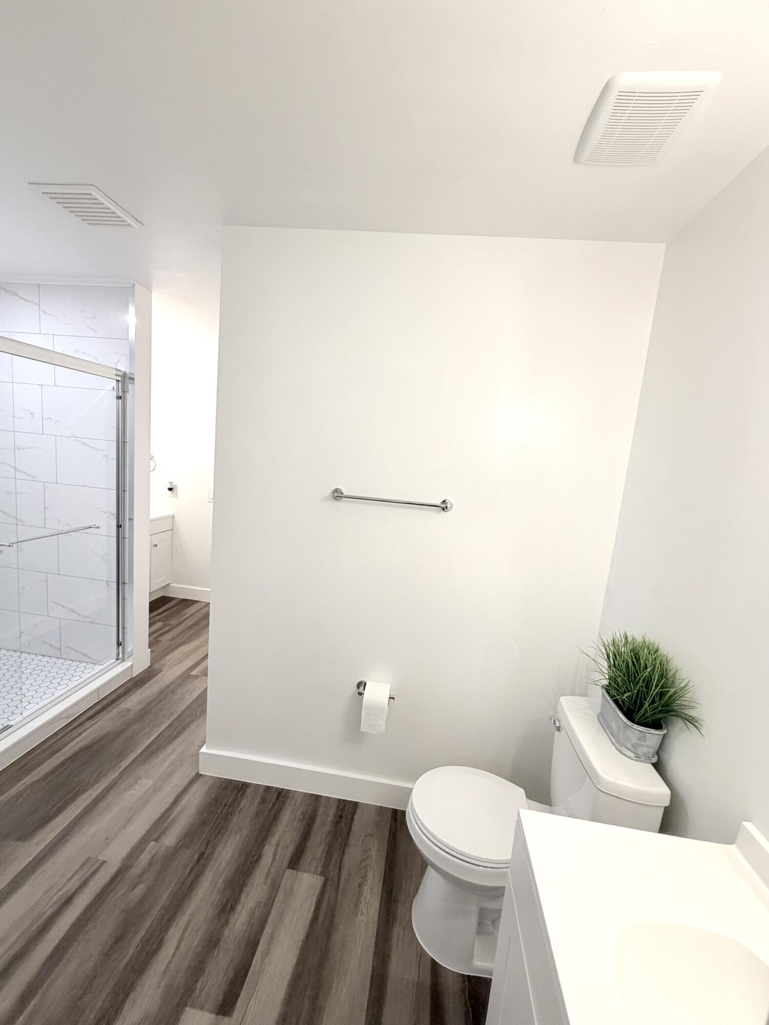11697 Southwest 19th Street Miramar, FL 33025 - Photo 12 of 48 a bathroom with a toilet and a shower