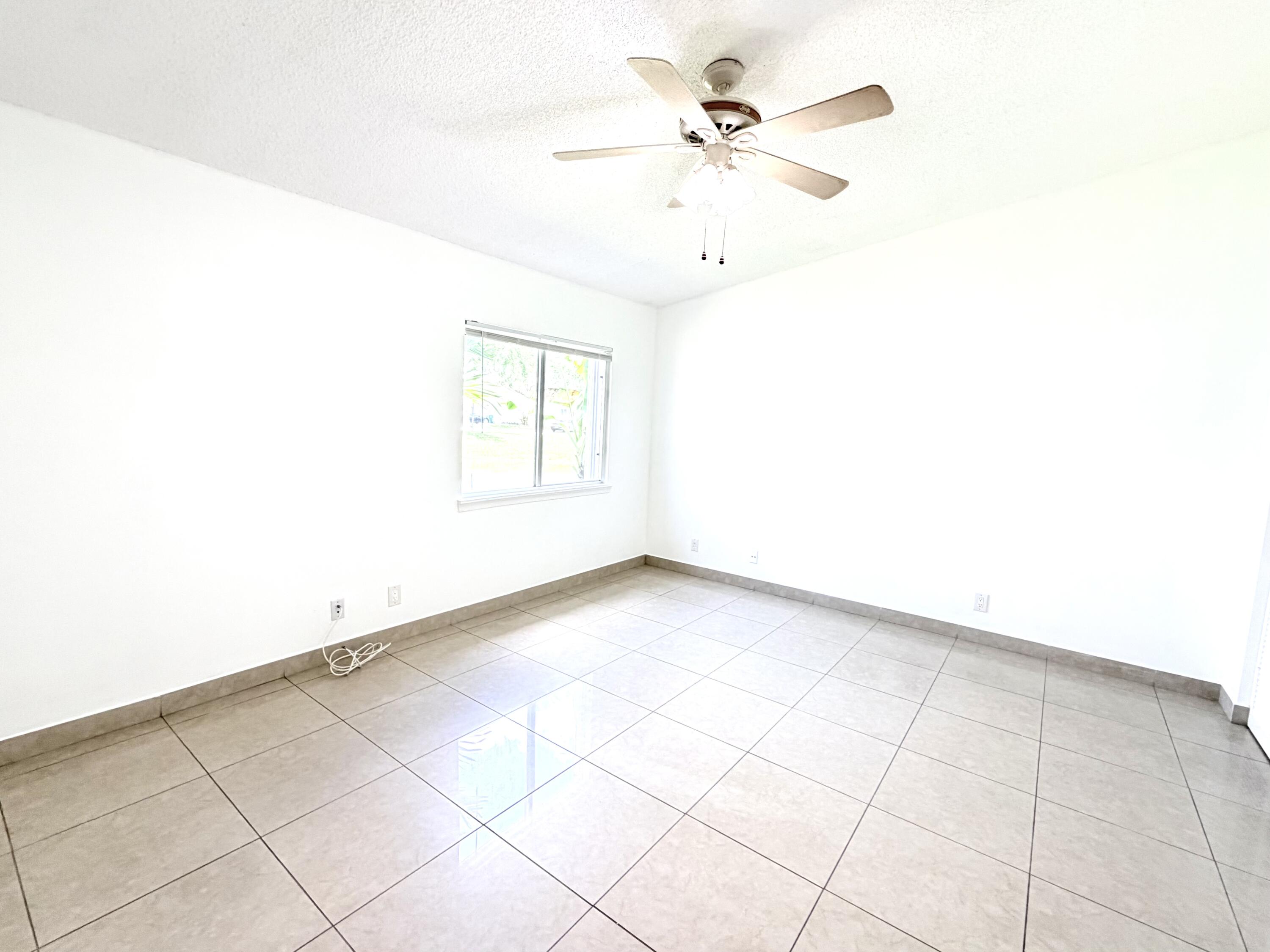 11697 Southwest 19th Street Miramar, FL 33025 - Photo 14 of 48 a view of an empty room with a window