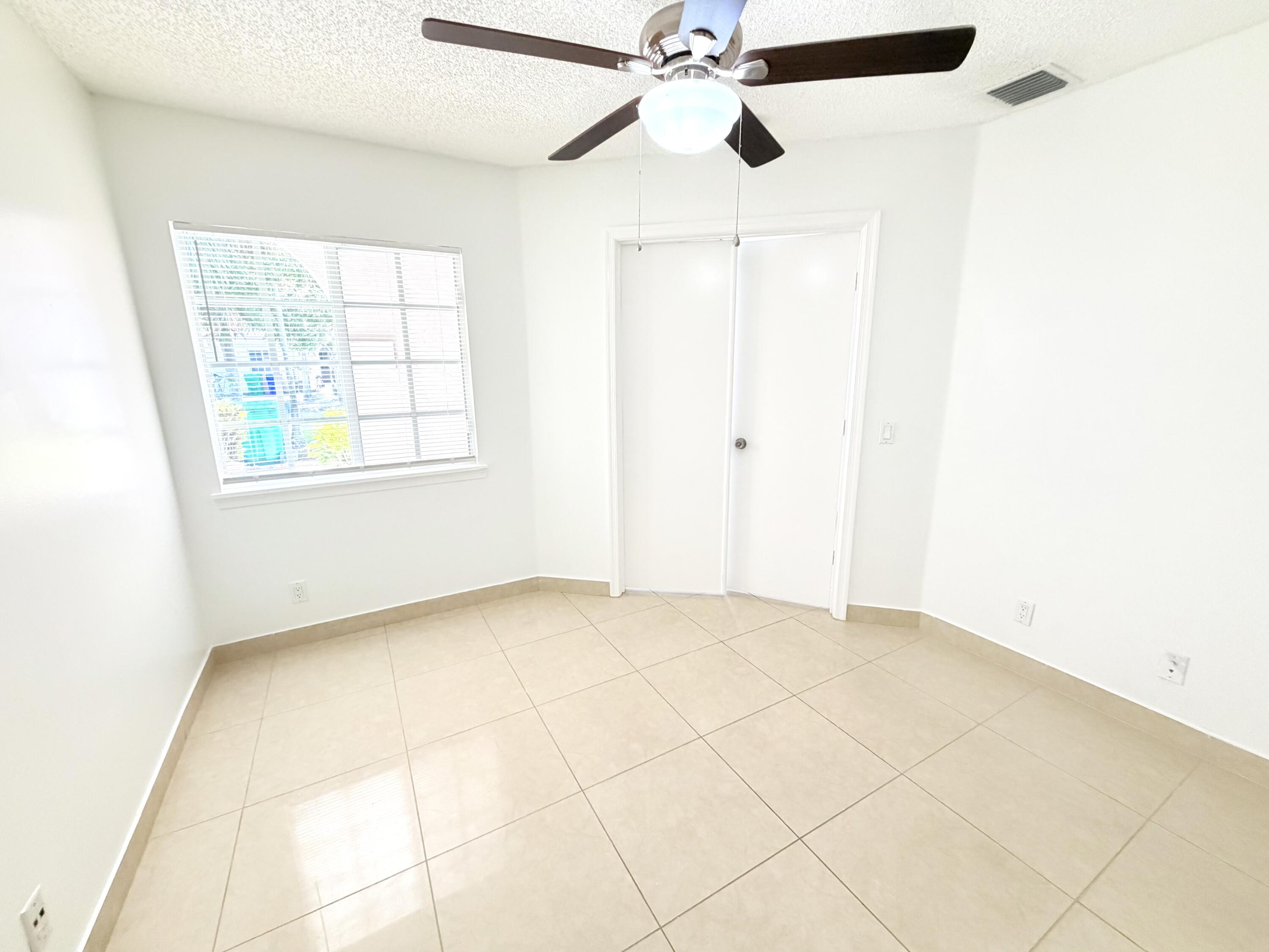11697 Southwest 19th Street Miramar, FL 33025 - Photo 17 of 48 a view of an empty room with a window
