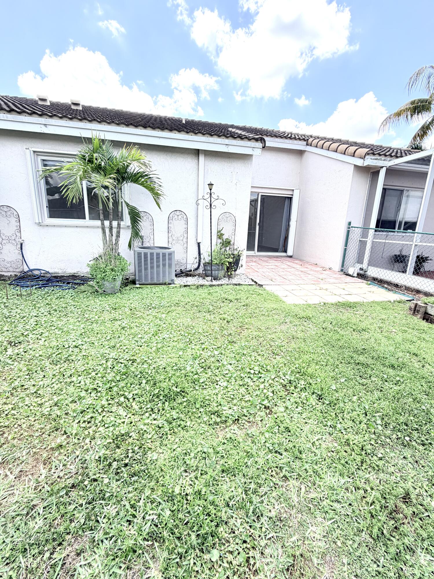 11697 Southwest 19th Street Miramar, FL 33025 - Photo 20 of 48 a front view of a house with garden