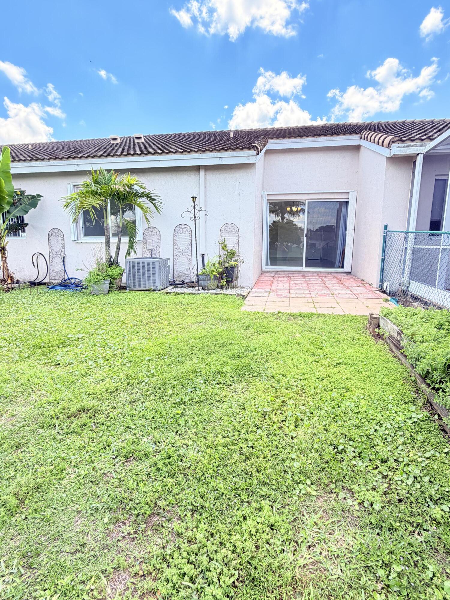 11697 Southwest 19th Street Miramar, FL 33025 - Photo 21 of 48 a house view with a garden space