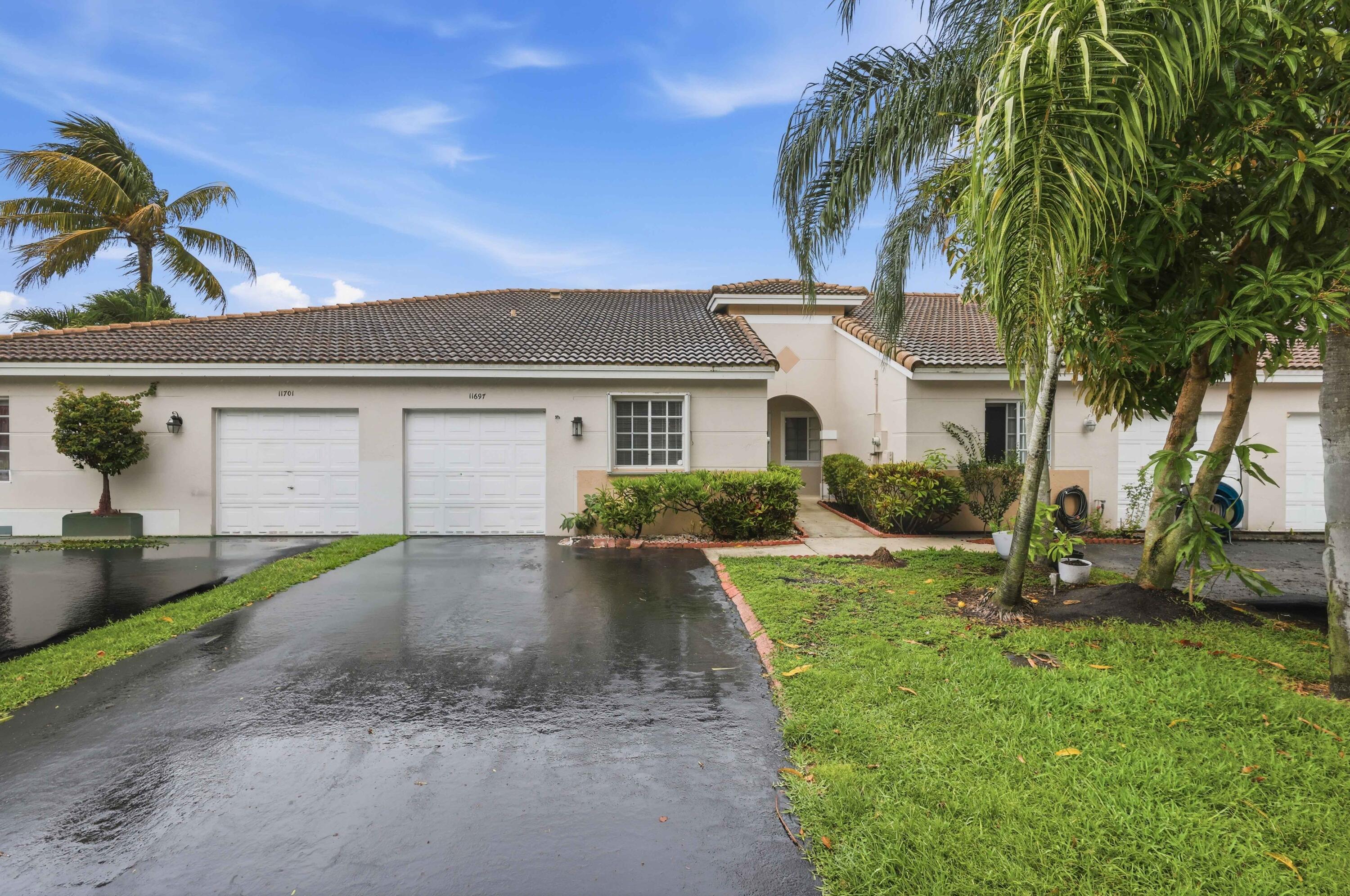 11697 Southwest 19th Street Miramar, FL 33025 - Photo 24 of 48 a front view of a house with garden