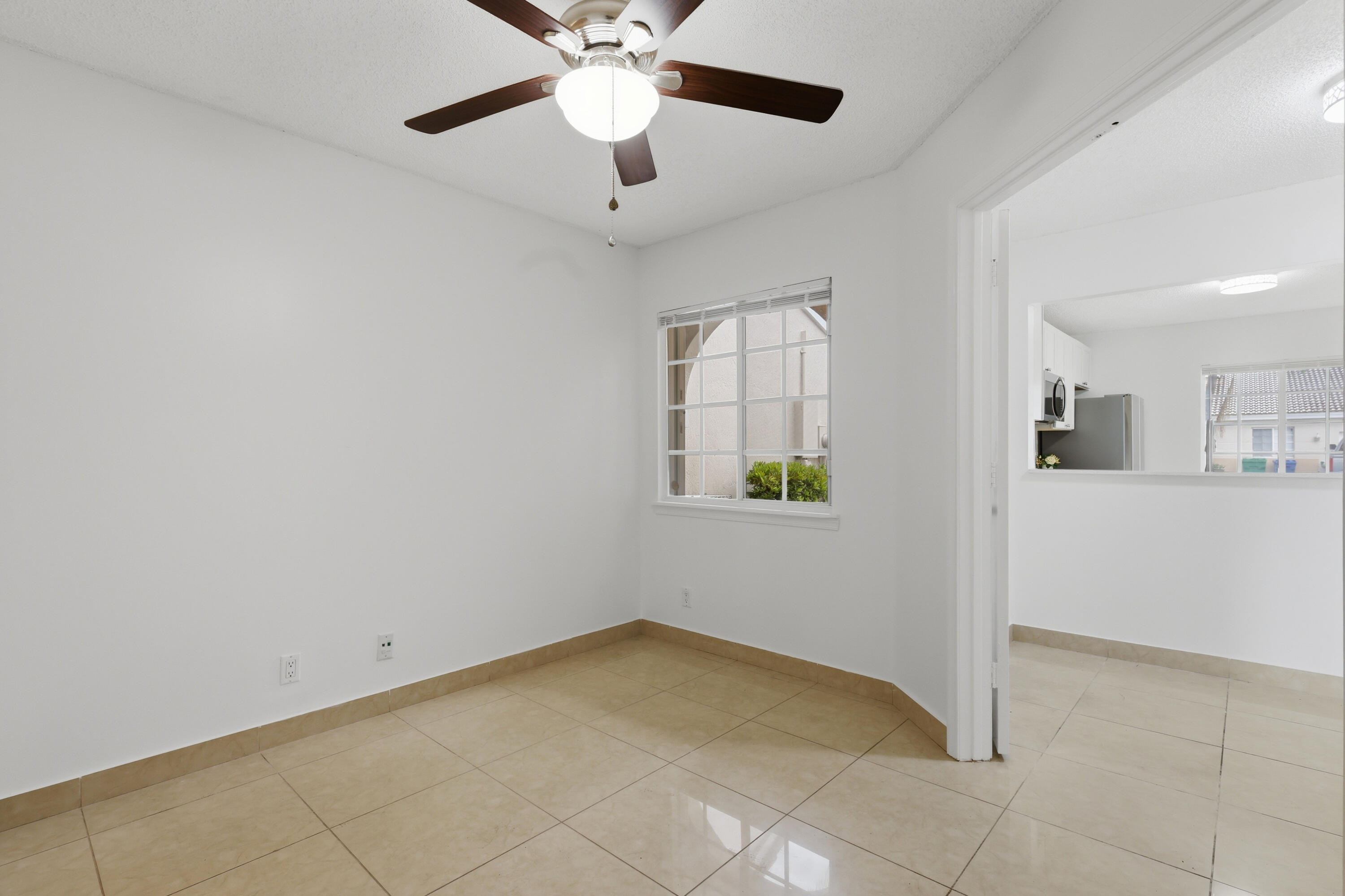 11697 Southwest 19th Street Miramar, FL 33025 - Photo 31 of 48 a view of an empty room with a window