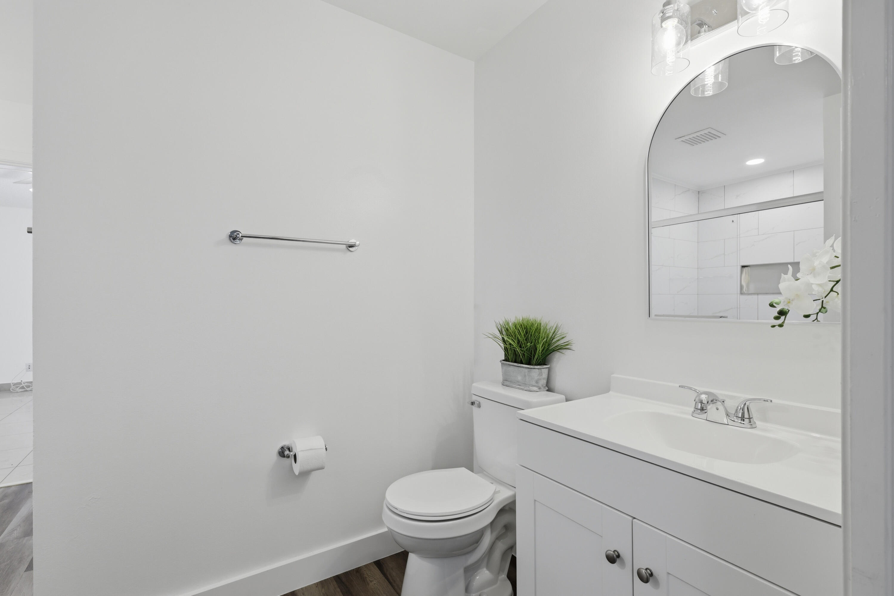 11697 Southwest 19th Street Miramar, FL 33025 - Photo 32 of 48 a bathroom with a sink toilet and a mirror