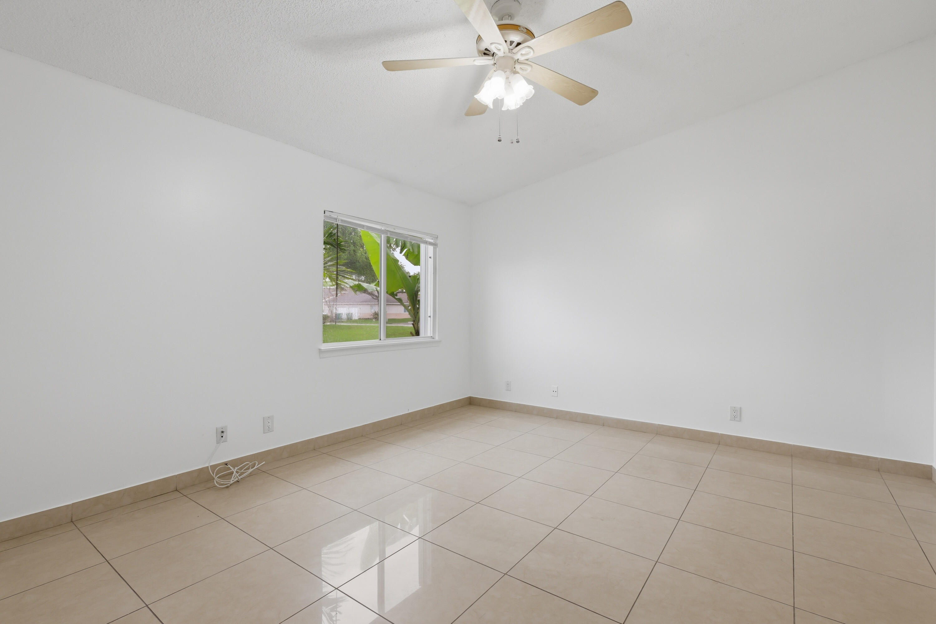 11697 Southwest 19th Street Miramar, FL 33025 - Photo 35 of 48 an empty room with windows and fan