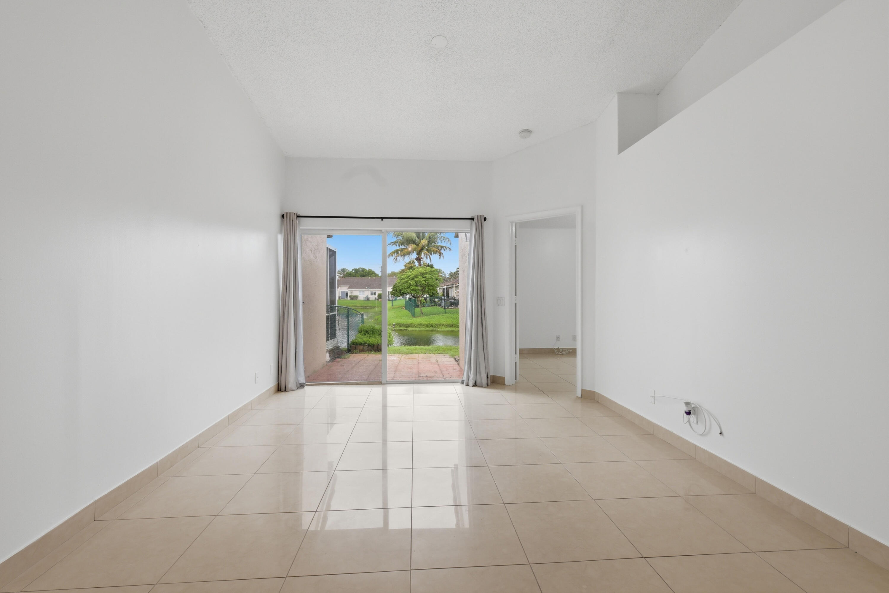 11697 Southwest 19th Street Miramar, FL 33025 - Photo 39 of 48 a view of an empty room with a window