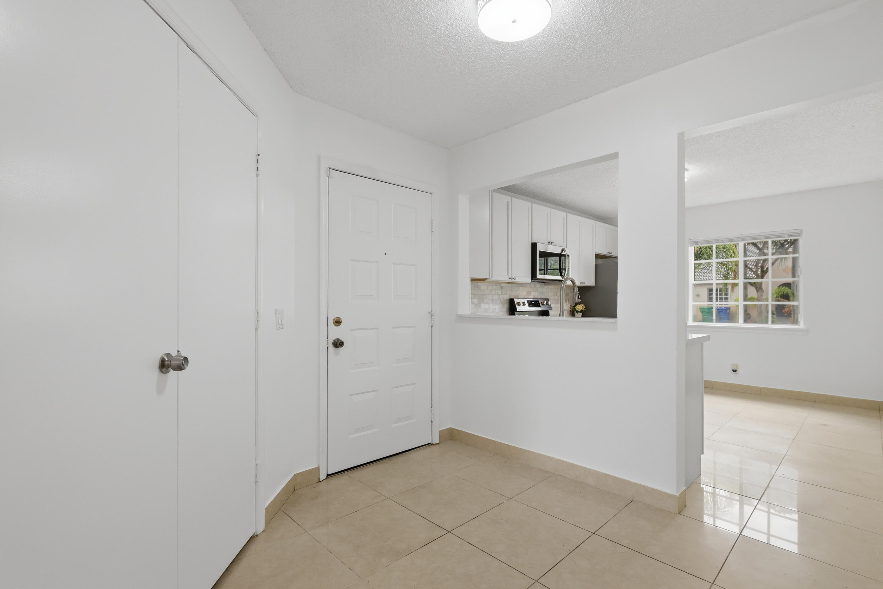 11697 Southwest 19th Street Miramar, FL 33025 - Photo 40 of 48 a view of kitchen with hallway and closet