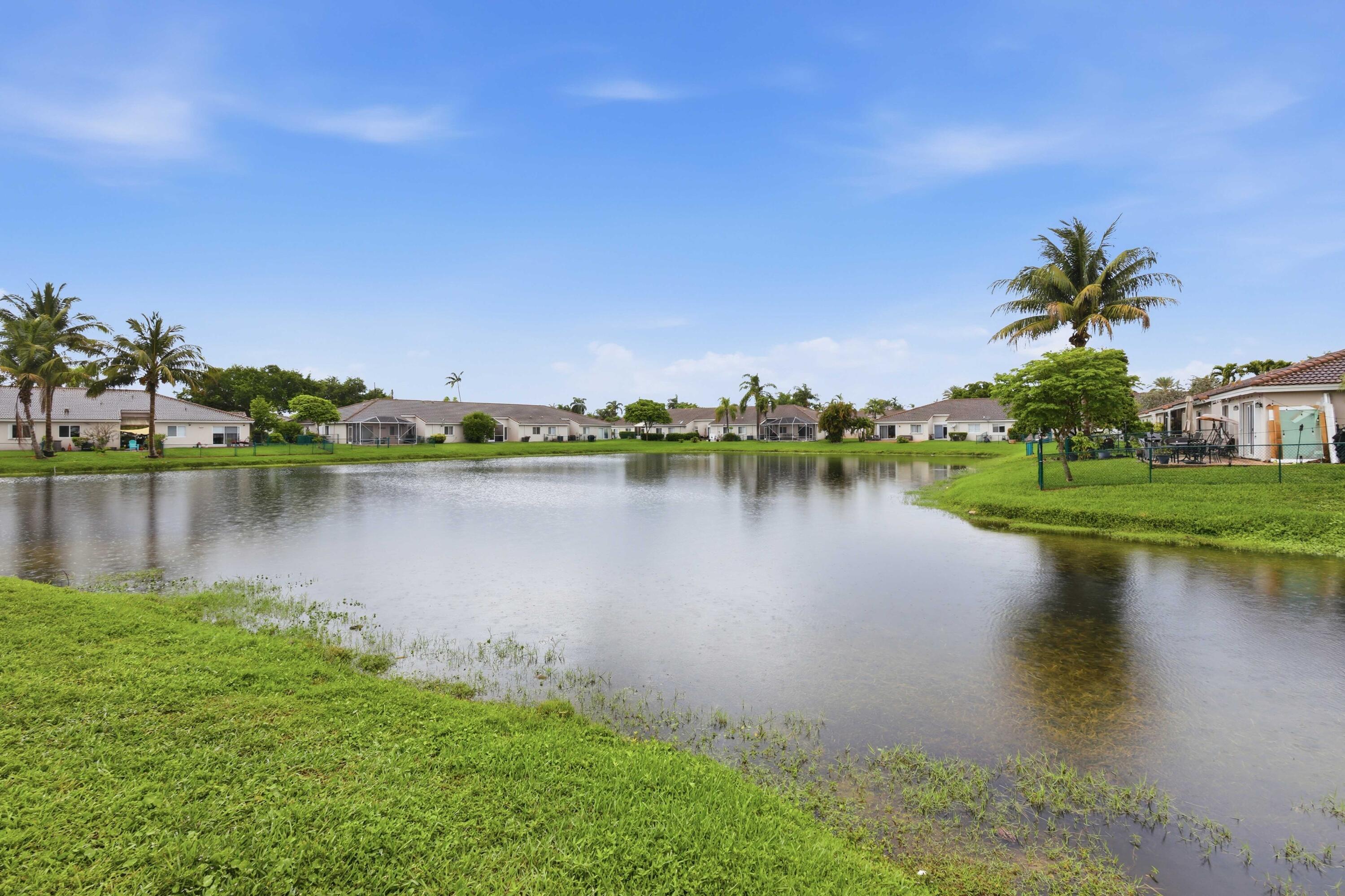 11697 Southwest 19th Street Miramar, FL 33025 - Photo 46 of 48 a view of a lake with houses in the back