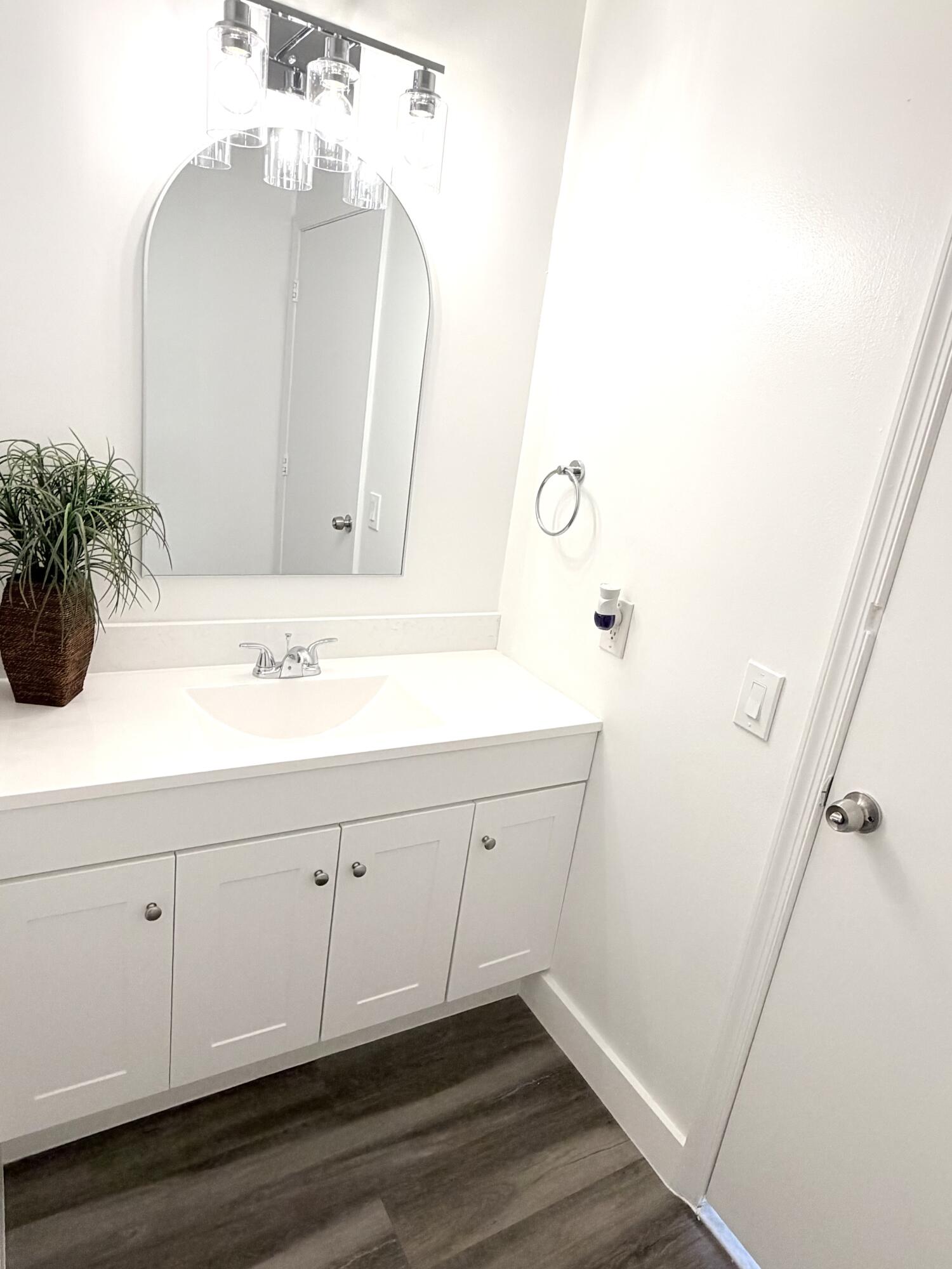 11697 Southwest 19th Street Miramar, FL 33025 - Photo 8 of 48 a bathroom with a sink and a mirror