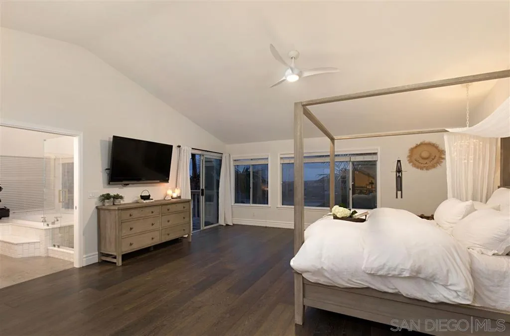 1836 Hawk View Drive Encinitas, CA 92024 - Photo 17 of 25 a bedroom with furniture and flat screen tv