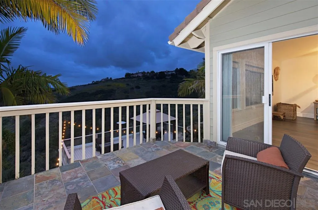 1836 Hawk View Drive Encinitas, CA 92024 - Photo 19 of 25 a balcony with table and chairs