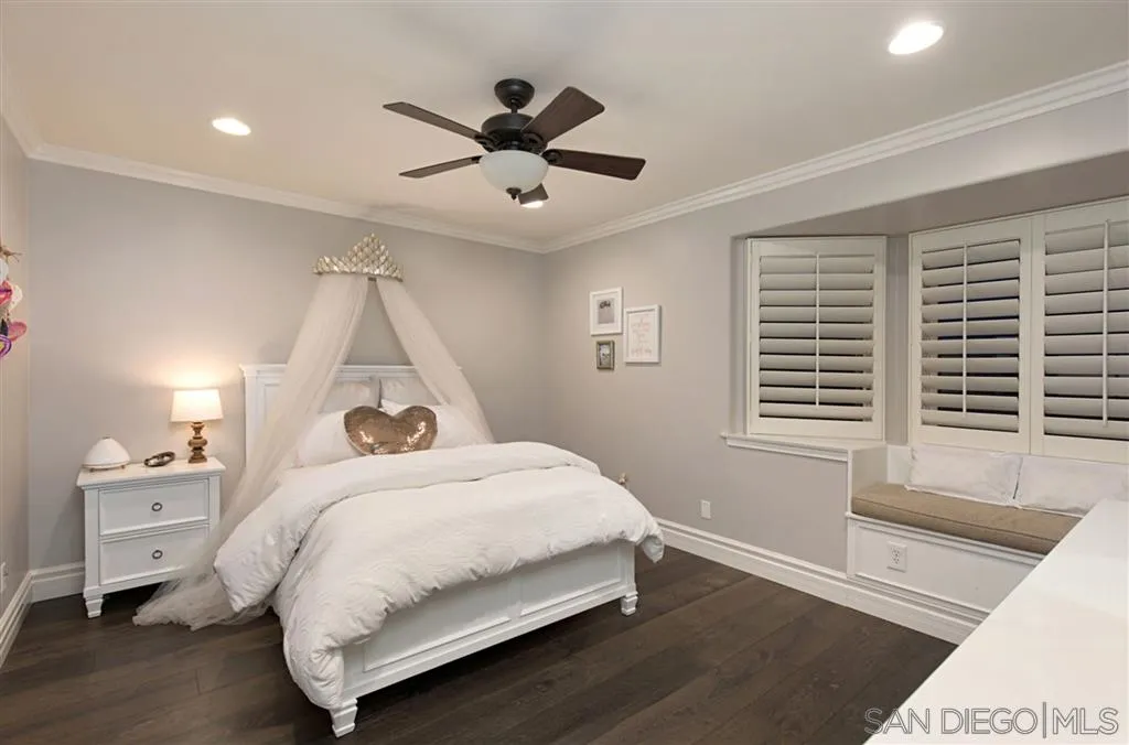 1836 Hawk View Drive Encinitas, CA 92024 - Photo 20 of 25 a bedroom with a bed and a large window