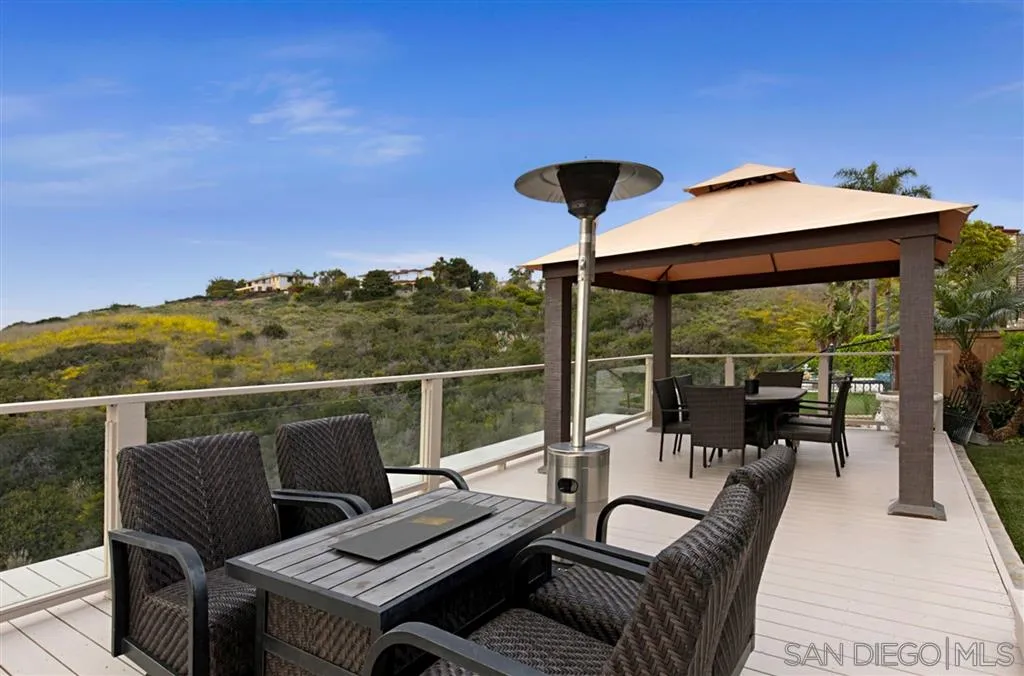 1836 Hawk View Drive Encinitas, CA 92024 - Photo 23 of 25 a view of a balcony with couch and wooden floor