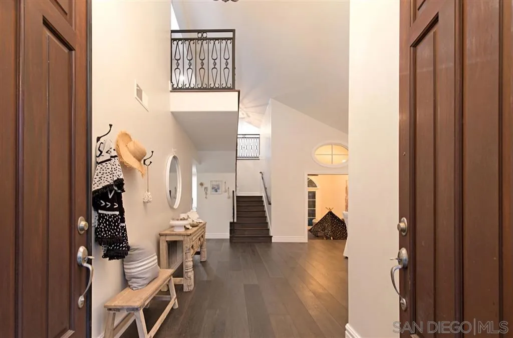1836 Hawk View Drive Encinitas, CA 92024 - Photo 4 of 25 a view of a hallway with wooden floor windows and entryway