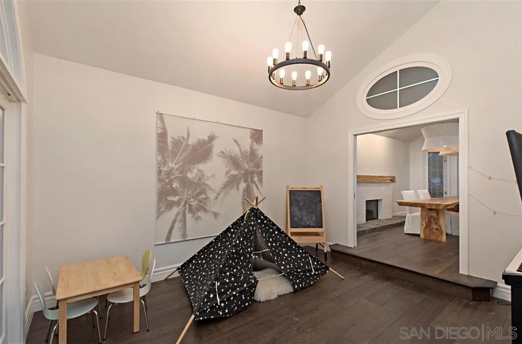 1836 Hawk View Drive Encinitas, CA 92024 - Photo 6 of 25 a spacious bedroom with a bed and dresser with wooden floor