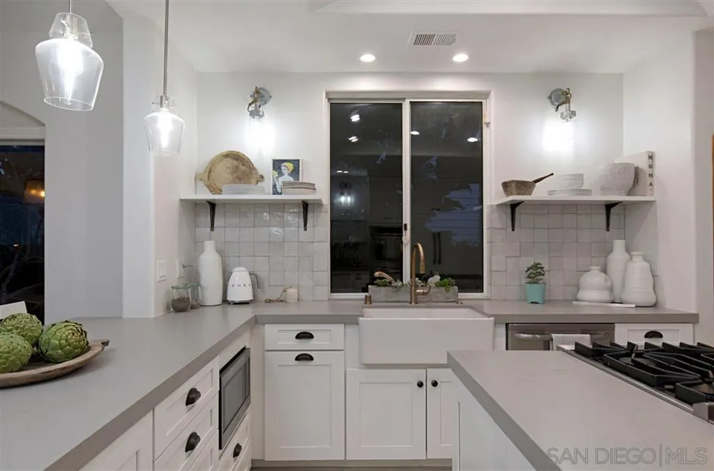 1836 Hawk View Drive Encinitas, CA 92024 - Photo 9 of 25 a kitchen with a sink and a stove