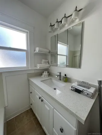 a bathroom with a sink and a mirror