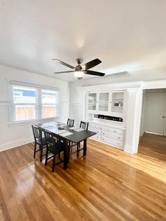 a view of a dining room with furniture and window