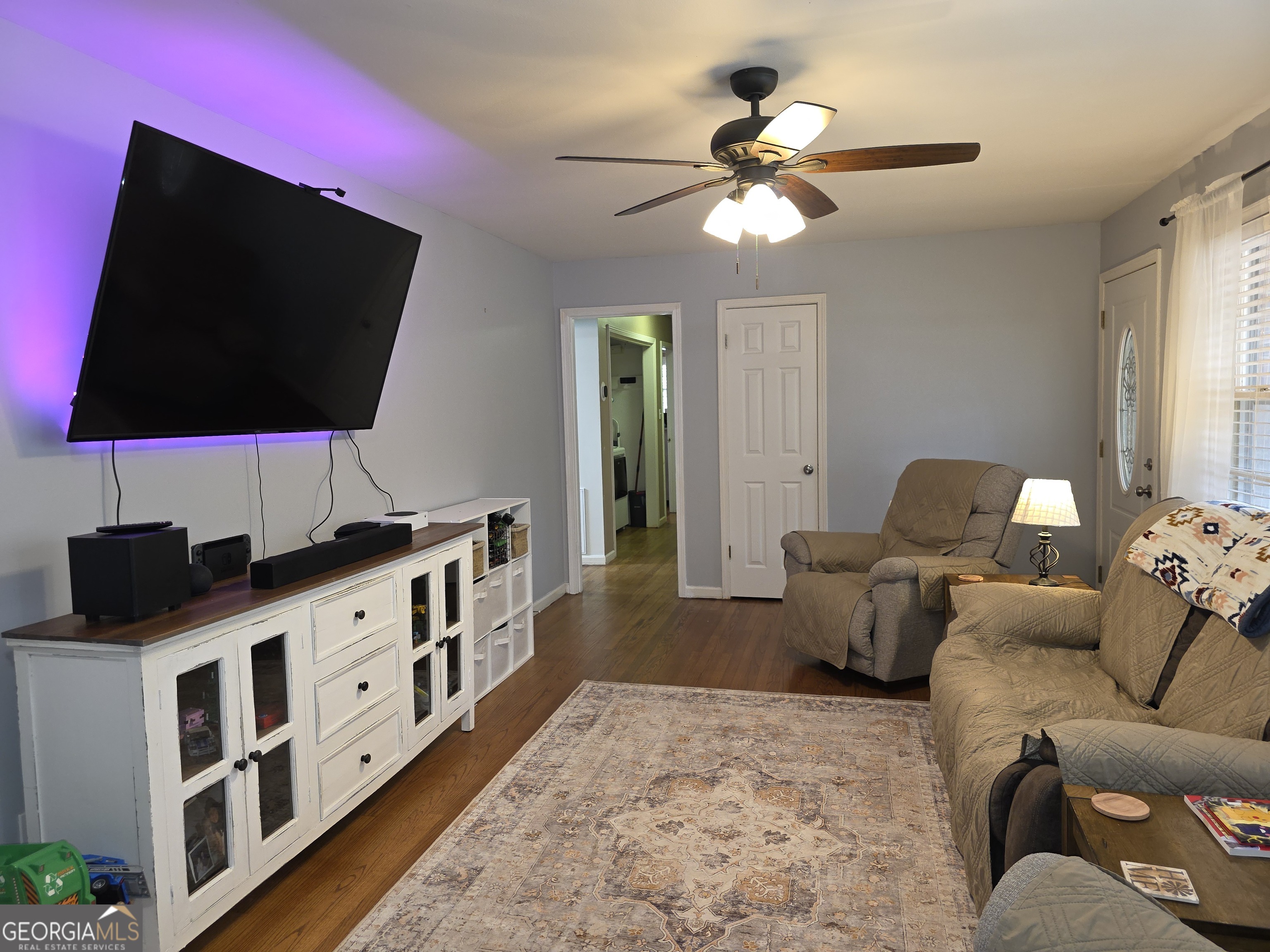 731 Seabreeze Lake Road Buchanan, GA 30113 - Photo 11 of 34 a living room with furniture and a flat screen tv