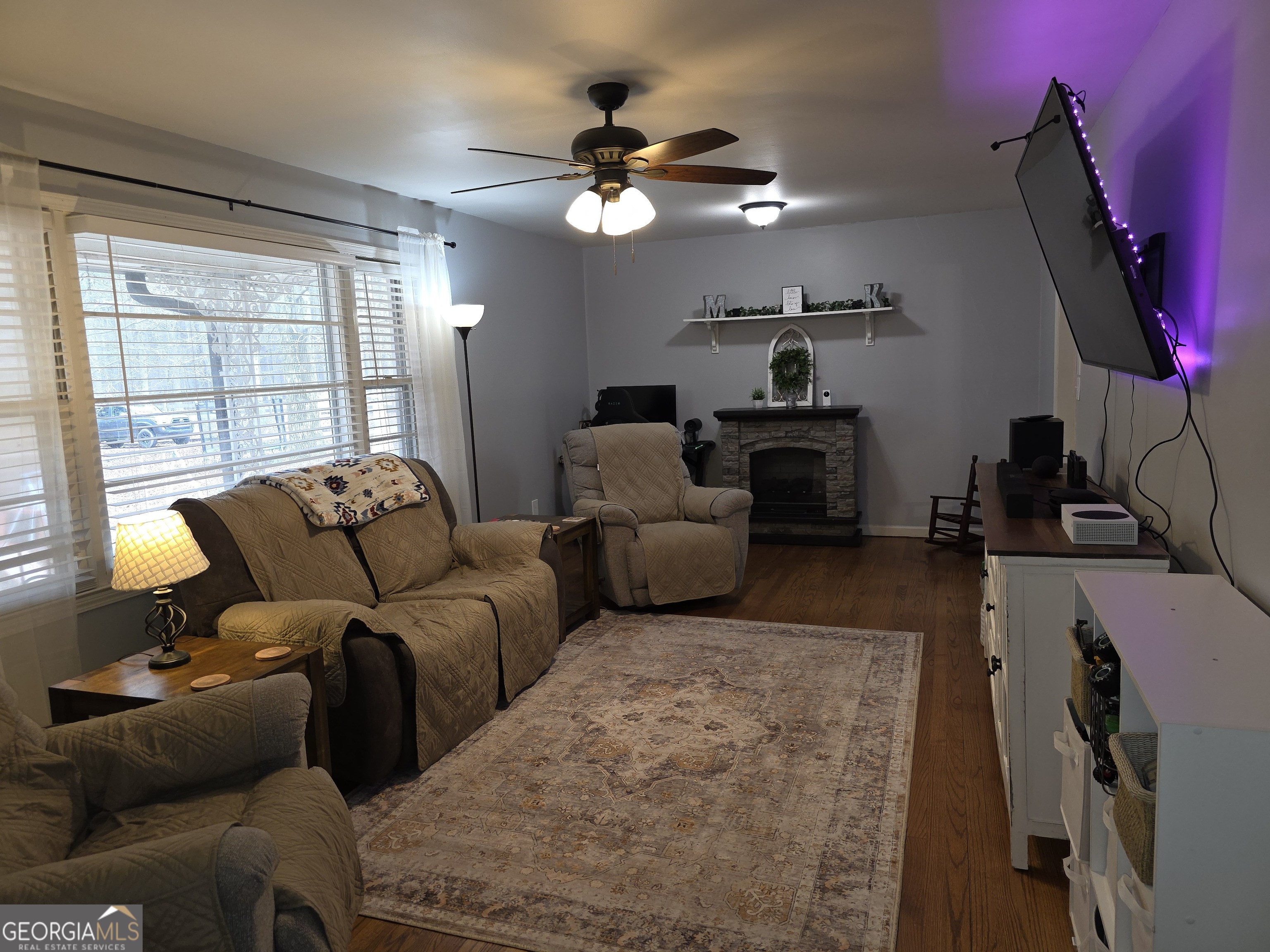 731 Seabreeze Lake Road Buchanan, GA 30113 - Photo 12 of 34 a living room with furniture and a large window