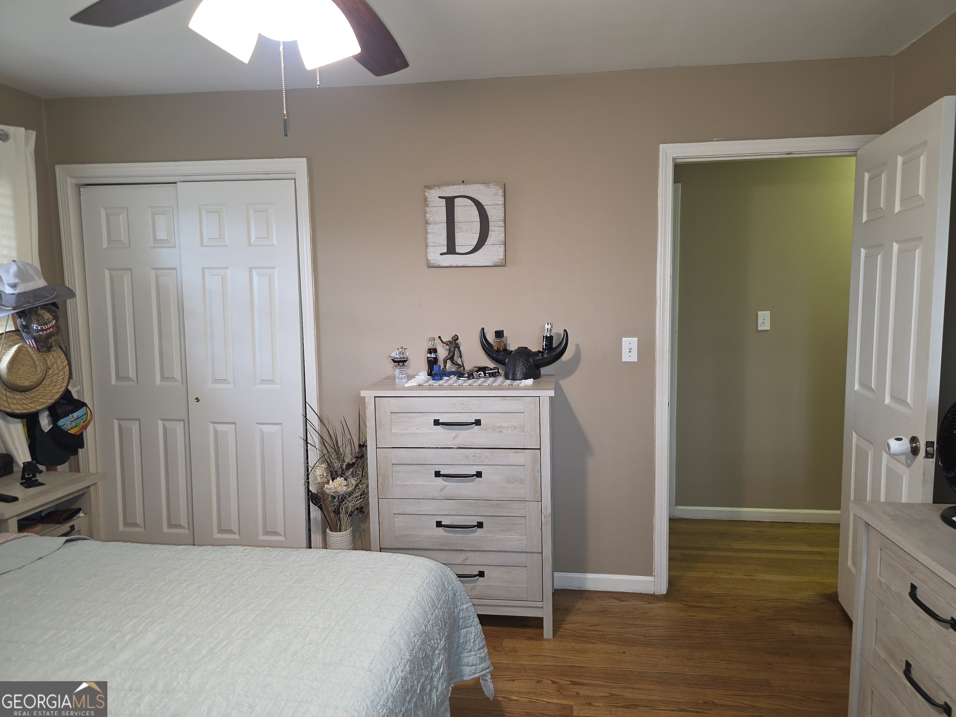 731 Seabreeze Lake Road Buchanan, GA 30113 - Photo 14 of 34 a bedroom with a bed and a chandelier