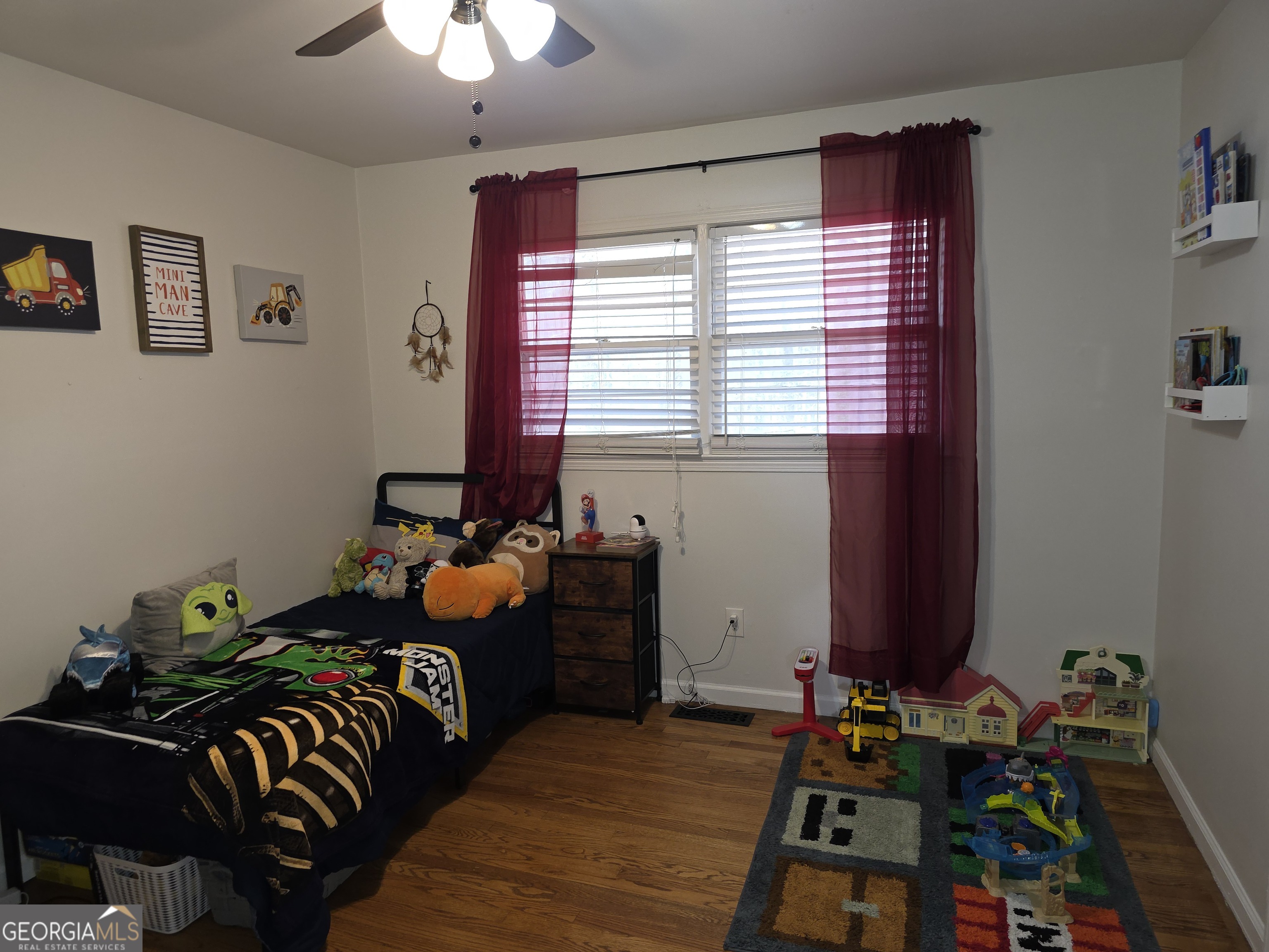 731 Seabreeze Lake Road Buchanan, GA 30113 - Photo 21 of 34 a bedroom with furniture and a window