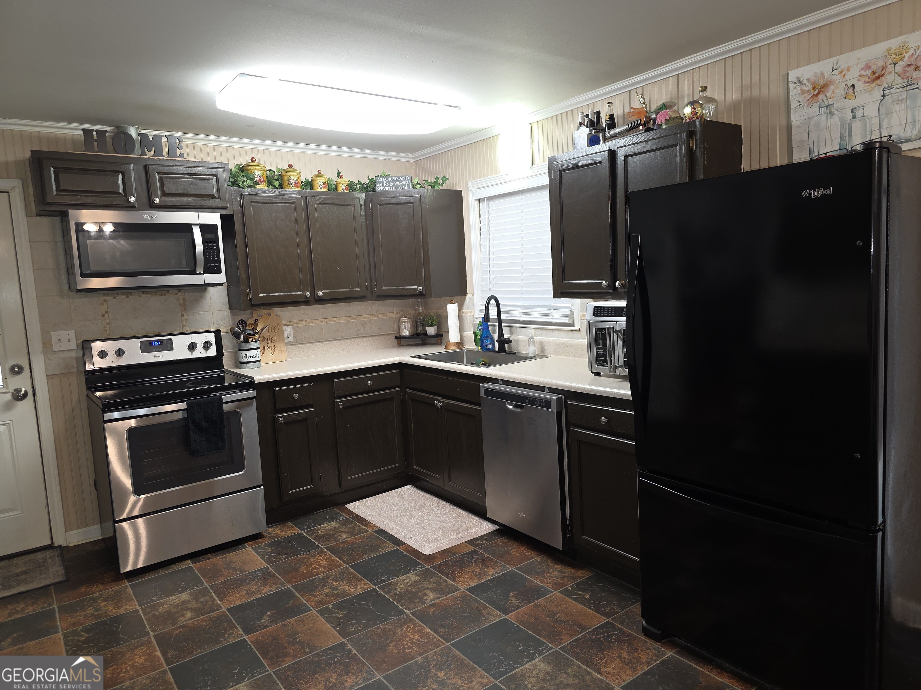 731 Seabreeze Lake Road Buchanan, GA 30113 - Photo 5 of 34 a kitchen with a sink stove and refrigerator