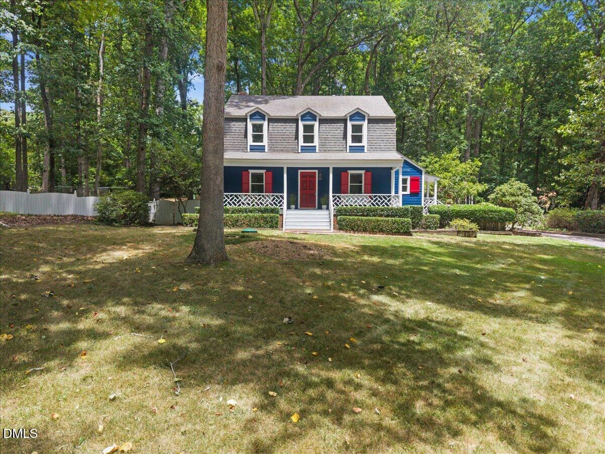 6516 Bakersfield Drive Raleigh, NC 27606 - Photo 54 of 59 a front view of a house with a yard