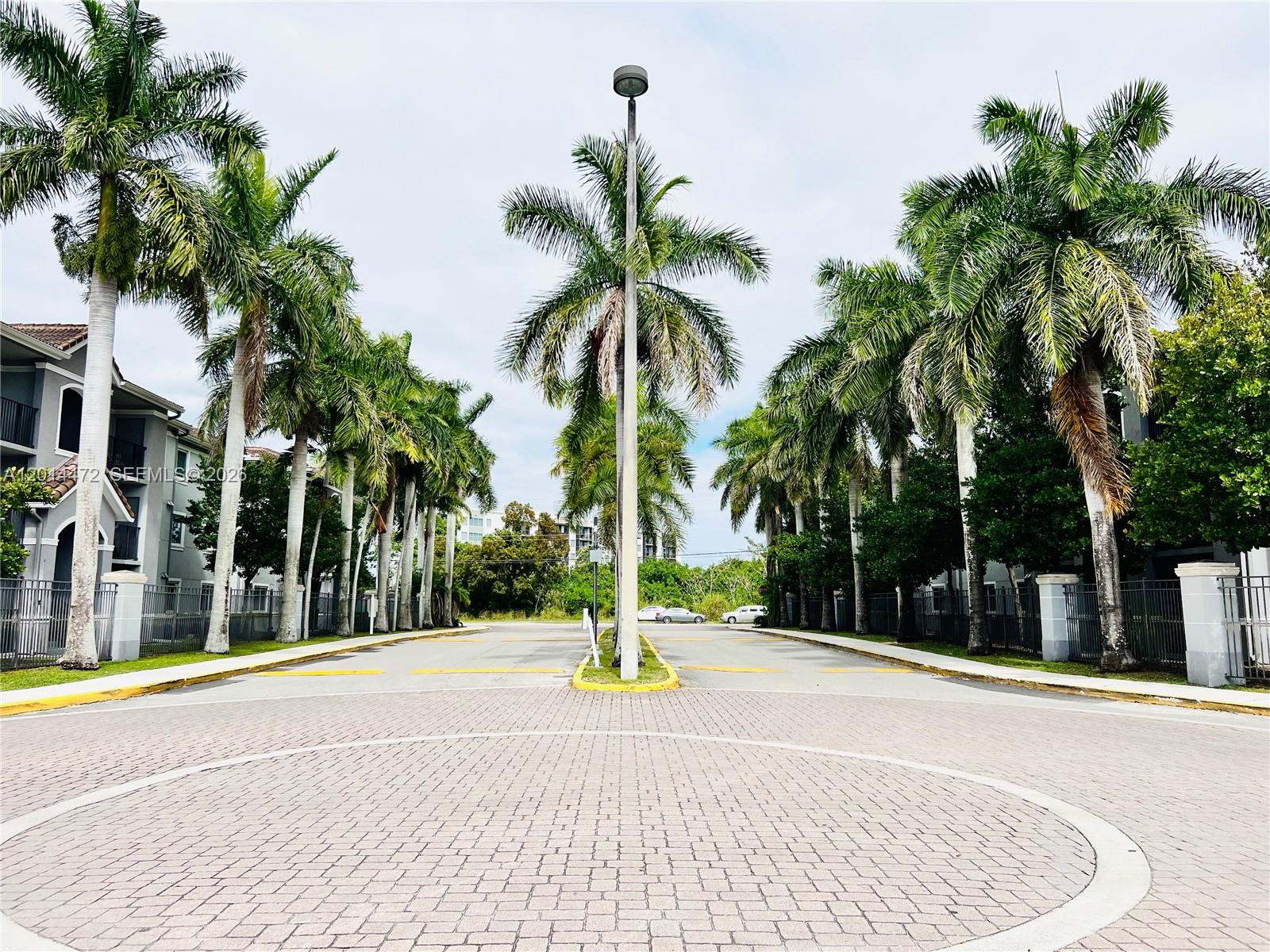 15410 Southwest 284th Street, Unit 8102 Homestead, FL 33033 - Photo 1 of 18 a view of swimming pool with palm trees