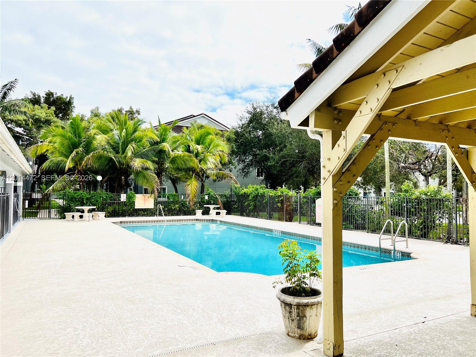 15410 Southwest 284th Street, Unit 8102 Homestead, FL 33033 - Photo 11 of 18 a view of a swimming pool with a patio